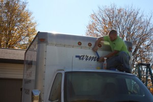 Jarrod doing a wrap on roof of a truck